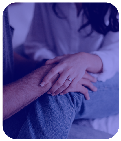married couple holding hands while talking