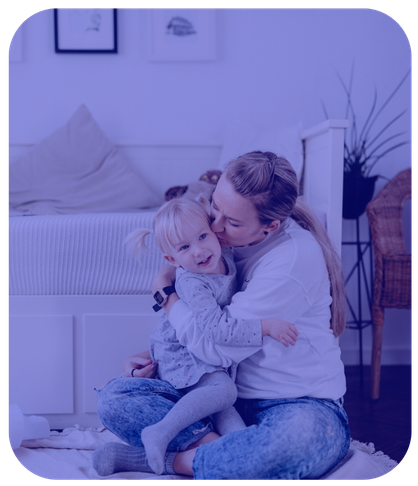 working mom coming home and hugging child
