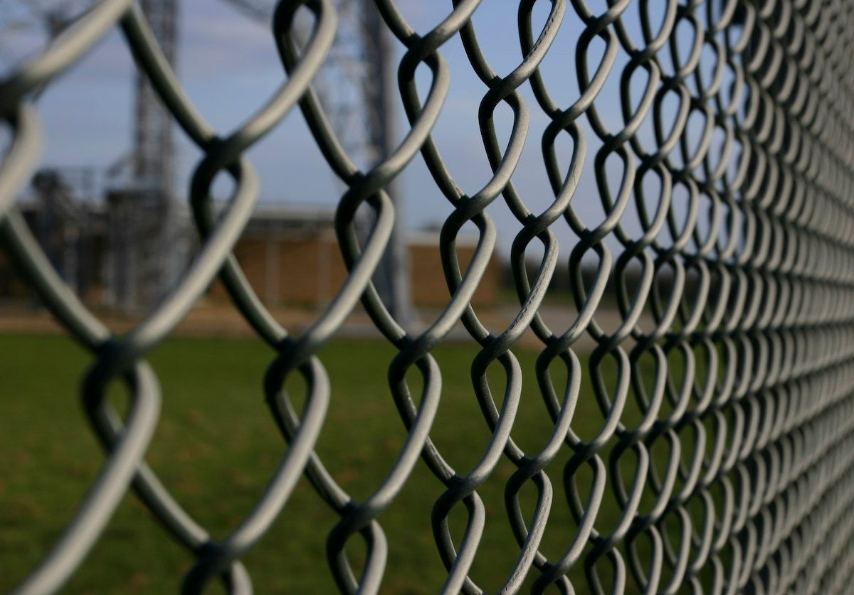Chain link fence painting in Rogers Park, Chicago