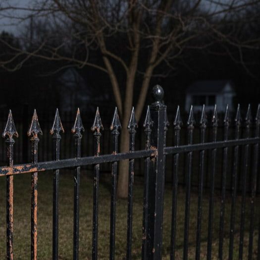Rusted iron fence before painting in East Ravenswood Chicago