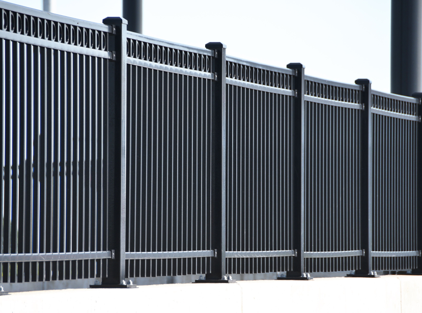 Metal fence painting in Old Town, IL for a black steel fence with vertical pickets. Metal Fence Painting in Old Town, IL