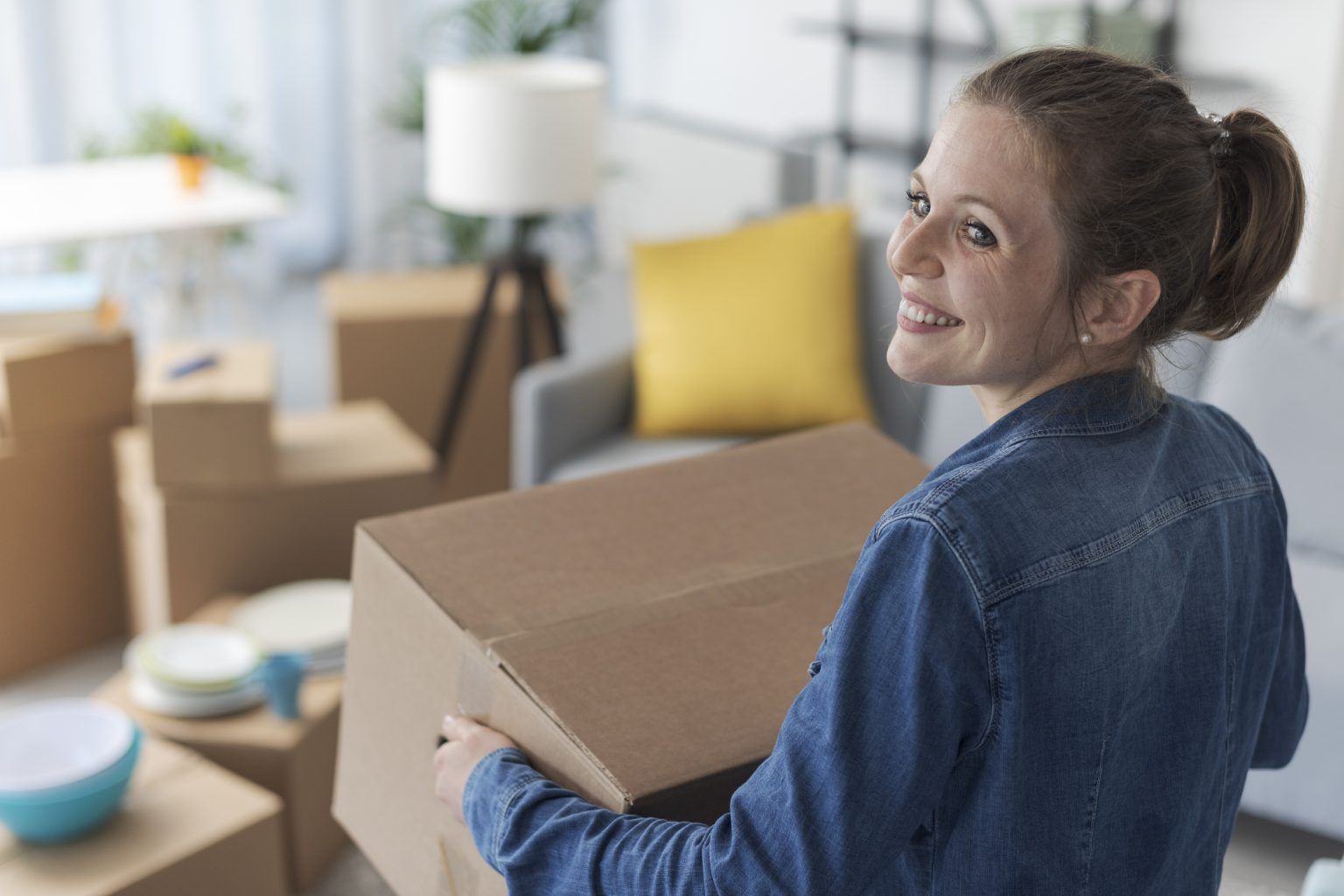 happy-woman-carrying-boxes-in-her-new-home-2023-11-27-04-54-13-utc-1536x1025.jpg