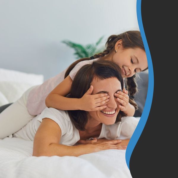 Image of a mom and daughter on a bed