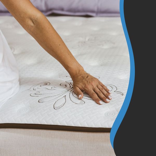 Image of a person touching a new mattress