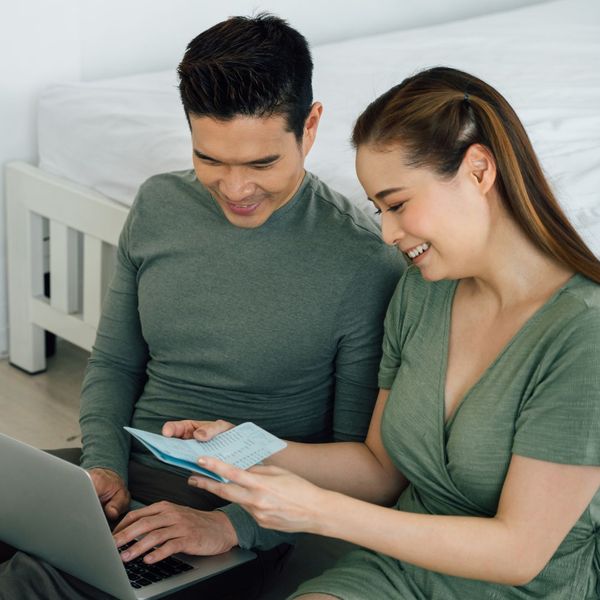 Image of a couple shopping for mattresses online