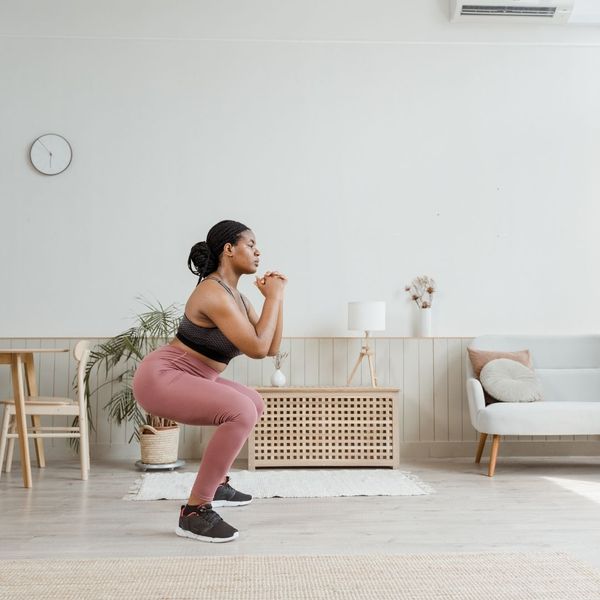 woman doing squats woman doing squats