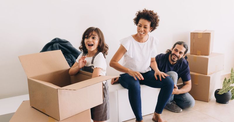 family unpacking boxes