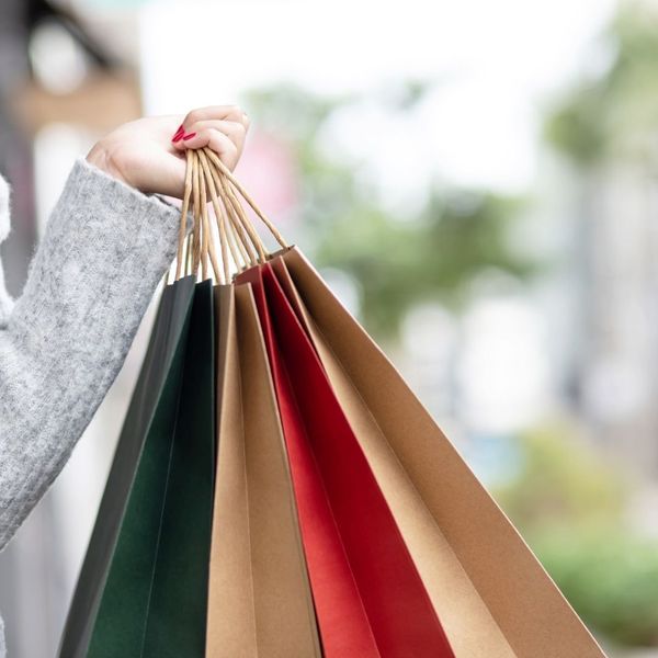 person holding shopping bags