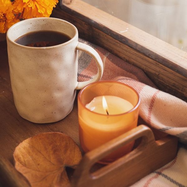 mug beside a scented candle
