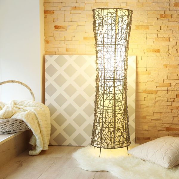 artful standing lamp in bedroom