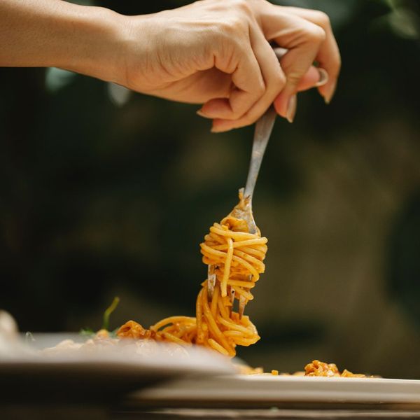person eating spaghetti person eating spaghetti
