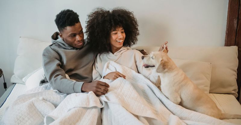 man and woman with a dog