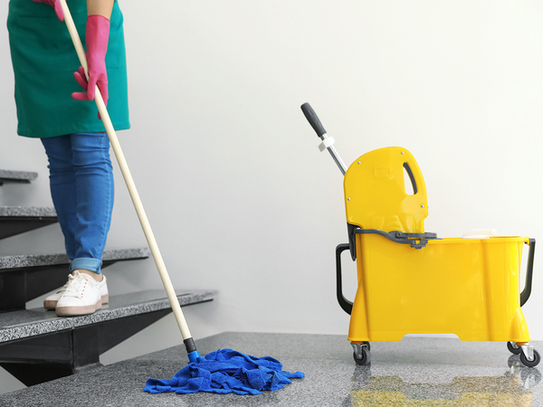 Image of a commercial cleaning crew mopping a floor.