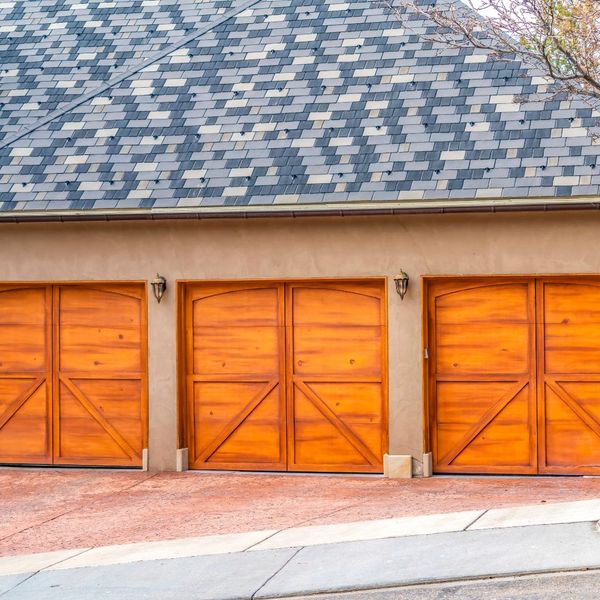 Three wooden garage doors