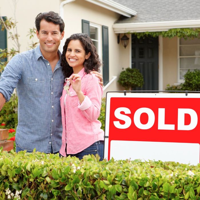 sellers of home with sold sign