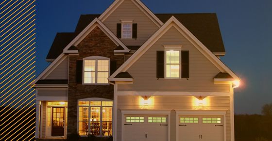 Street view of a home with lights on