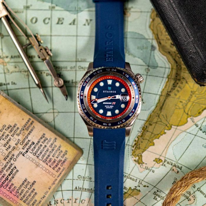 photo of an Etairos watch on a world map