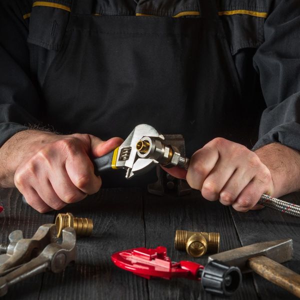 Plumber working with tools