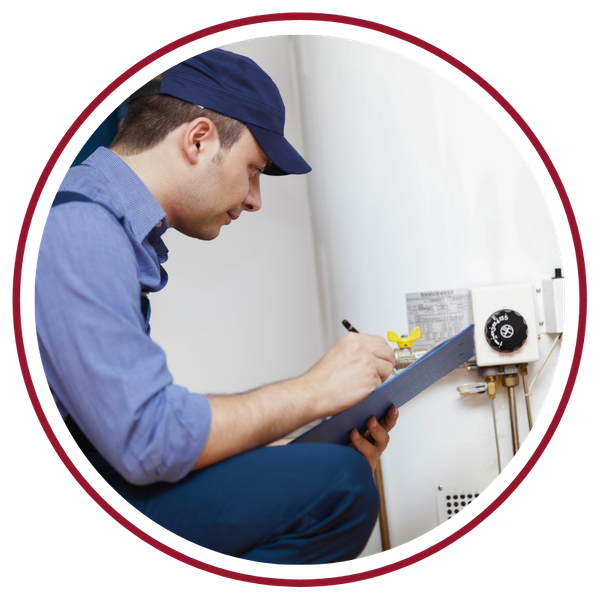 plumber conducting water heater maintenance