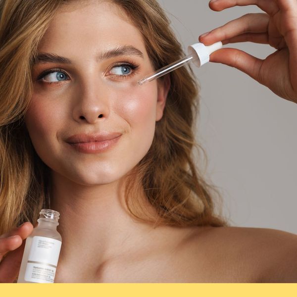 woman applying skincare serum