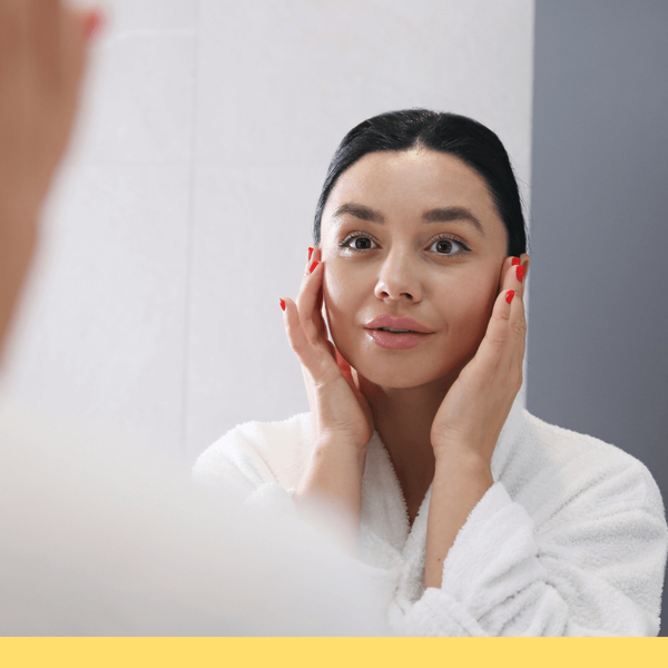 woman looking in mirror