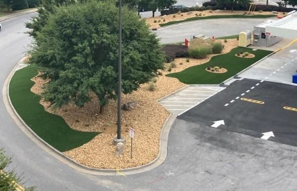 Artificial turf with rocks, trees, and more
