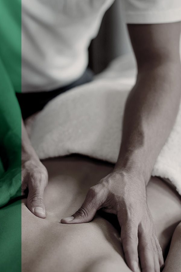 Person lying on massage table getting a deep tissue massage Person getting a deep tissue massage