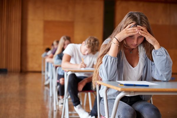 1920_stock-photo-anxious-teenage-student-sitting-examination-in-school-hall-774167659.jpg