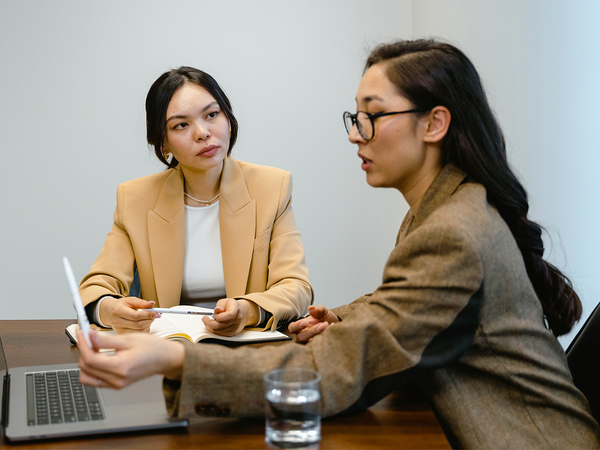 Two women working together