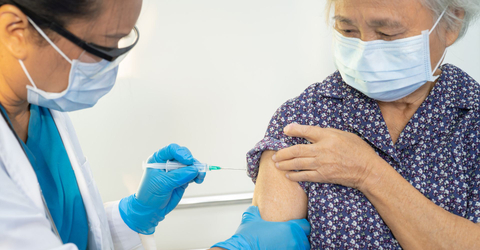 woman getting a vaccination