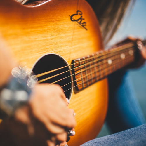 man strumming guitar 