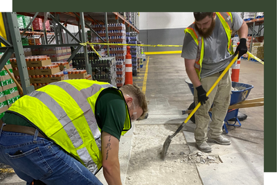 2 workers fixing concrete