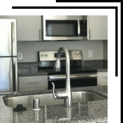 closeup of remodeled kitchen and new faucet closeup of remodeled kitchen and new faucet