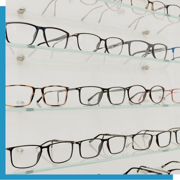 Display wall filled with various eyeglass frames   