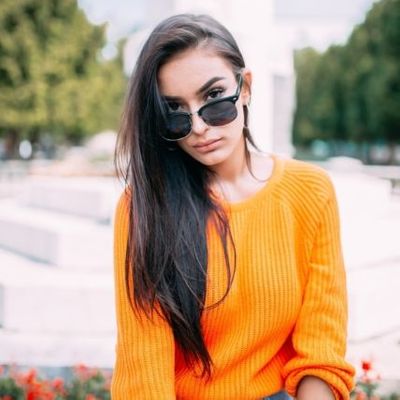 girl-in-orange-sweater-wearing-sunglasses-640-427x427.jpg