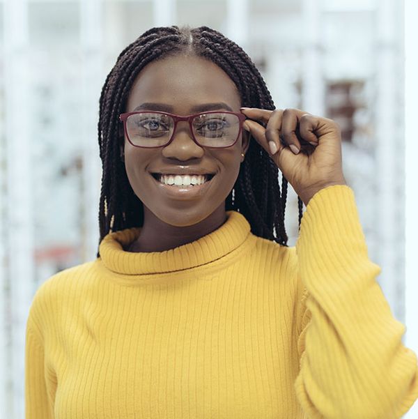 african-american-woman-showing-glasses-yellow-sweater.jpg
