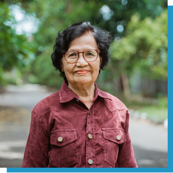 elderly woman smiling with glasses 