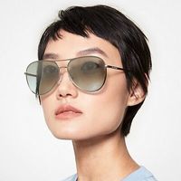 asian-woman-wearing-green-tinted-michael-kors-sunglasses.jpeg