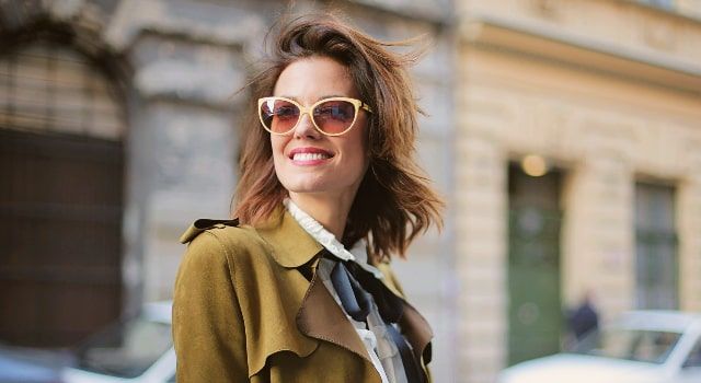woman-smiling-wearing-stylish-sunglasses_640x350-min.jpg