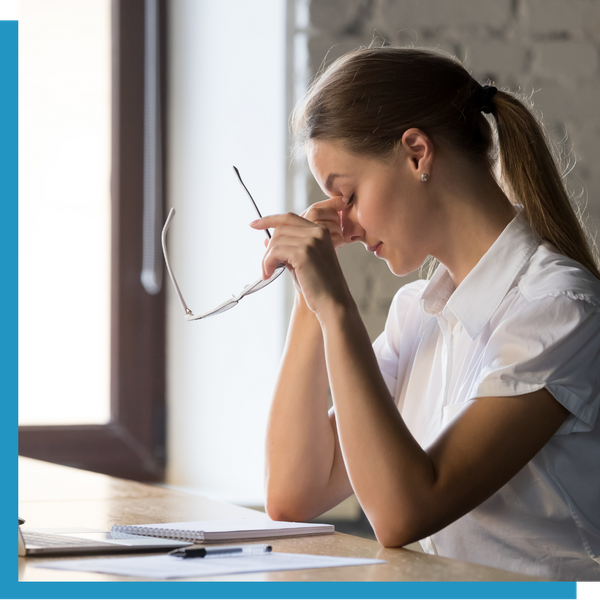 A woman feeling eye strain.