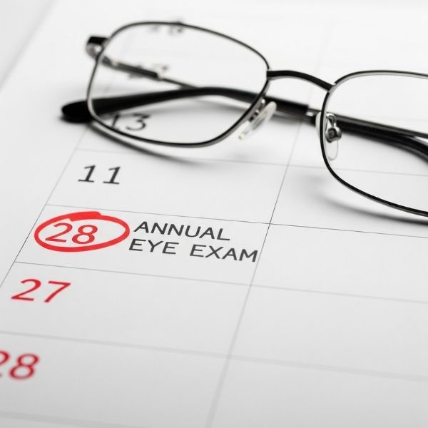 calendar page with a date circled and marked "Annual Eye Exam" calendar page with a date circled and marked "Annual Eye Exam"