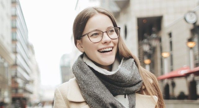 happy-woman-wearing-eyeglasses-in-winter.jpg