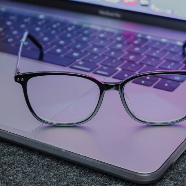 blue light glasses on laptop