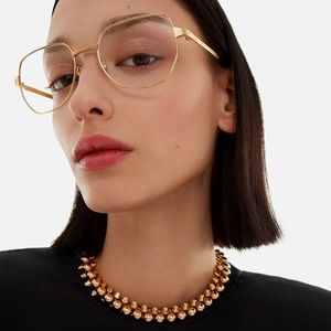 woman-wearing-gold-rimed-cartier-eyeglasses.jpg