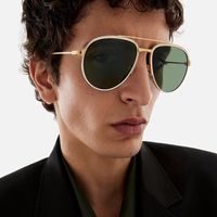 man-wearing-green-tinted-cartier-sunglasses.jpg