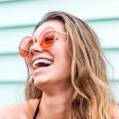 woman-pink-sunglasses-round-smiling-640-426x427.jpg