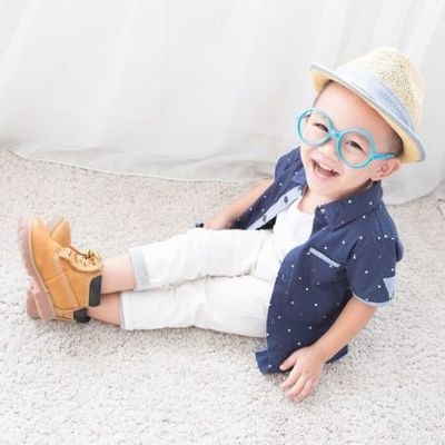 happy-little-boy-wearing-blue-rimmed-eyeglasses-640-427x427.jpg