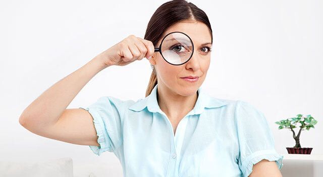 person-looking-through-magnifying-glass.jpg