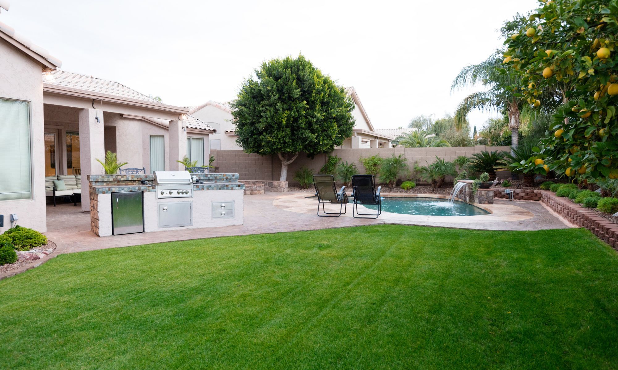 landscaped backyard with pool