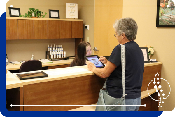 a patient at the front desk